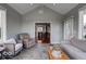 Cozy sunroom filled with natural light, comfortable seating, and access to the outdoors at 9615 N County Road 150 E Rd, Pittsboro, IN 46167