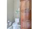 A toilet room next to a storage cabinet, featuring a neutral wall color at 9615 N County Road 150 E Rd, Pittsboro, IN 46167