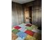 Unique bedroom with wood paneled walls and colorful carpet tiles at 9704 Porter Dr, Avon, IN 46123