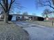 Charming brick home with a spacious driveway and a well-maintained front yard at 9704 Porter Dr, Avon, IN 46123