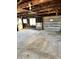 Garage with exposed ceiling, natural light, and unfinished walls, perfect for workshop or storage at 9704 Porter Dr, Avon, IN 46123