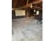 Open garage space with a concrete floor, exposed wooden beams, and ample natural light at 9704 Porter Dr, Avon, IN 46123