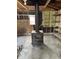 Cozy living space featuring a wood burning stove and exposed framing at 9704 Porter Dr, Avon, IN 46123