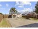 Large backyard featuring a concrete patio, well-maintained lawn, and a wood fence at 1019 Lennox St, Anderson, IN 46012