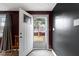 Inviting entryway with wood-look flooring and a view of the backyard through the front door at 1019 Lennox St, Anderson, IN 46012