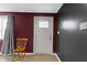 Entryway with new paint and wood-look flooring provides a warm welcome at 1019 Lennox St, Anderson, IN 46012