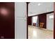 Inviting view of the front door and an adjacent room, featuring wood floors and natural light at 1019 Lennox St, Anderson, IN 46012