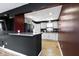 Kitchen with white cabinetry, granite countertops, and modern appliances, providing a functional and stylish cooking space at 1019 Lennox St, Anderson, IN 46012