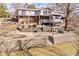 A beautifully landscaped backyard with multiple levels and retaining walls at 1020 W Riverview Dr, Anderson, IN 46011