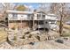 A beautifully landscaped backyard with multiple levels and retaining walls at 1020 W Riverview Dr, Anderson, IN 46011
