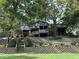 Lush backyard with well-maintained terraces and mature trees, creating a private oasis at 1020 W Riverview Dr, Anderson, IN 46011