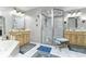 Well-appointed bathroom with double vanities and a glass-enclosed shower at 1020 W Riverview Dr, Anderson, IN 46011