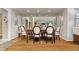 Inviting dining room with hardwood floors, decorative mirrors, and seating for six at 1020 W Riverview Dr, Anderson, IN 46011