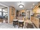 Well-lit kitchen with stainless steel appliances, tile flooring, and adjacent dining area at 1020 W Riverview Dr, Anderson, IN 46011
