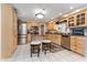 Charming kitchen featuring stainless steel appliances, granite countertops, and breakfast bar seating at 1020 W Riverview Dr, Anderson, IN 46011