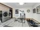 Bright laundry room with modern washer and dryer and space for exercise equipment at 1020 W Riverview Dr, Anderson, IN 46011