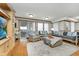 Bright and airy living room with comfortable seating, sliding doors, and built-in cabinetry at 1020 W Riverview Dr, Anderson, IN 46011