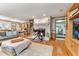 Spacious living room featuring a fireplace, wood floors, and comfortable seating at 1020 W Riverview Dr, Anderson, IN 46011