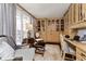 Cozy living room featuring built-in cabinets, hardwood flooring, and natural light at 1020 W Riverview Dr, Anderson, IN 46011