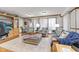 Inviting living room with comfortable seating, a large window, and built-in cabinetry at 1020 W Riverview Dr, Anderson, IN 46011