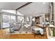 Inviting living room area with a fireplace and large windows, perfect for entertaining guests at 1020 W Riverview Dr, Anderson, IN 46011