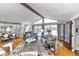 Sun-drenched living room with high ceilings and large windows, ideal for relaxation at 1020 W Riverview Dr, Anderson, IN 46011