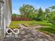 Backyard featuring a small garden and flagstone patio area at 11215 Cowan Lake Ct, Indianapolis, IN 46235