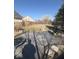 Spacious backyard features a stone patio, well-maintained lawn, and barbecue grill at 11215 Cowan Lake Ct, Indianapolis, IN 46235