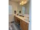 Functional bathroom featuring a double sink vanity, a large mirror, and neutral accents at 11215 Cowan Lake Ct, Indianapolis, IN 46235