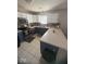 Well-lit kitchen featuring white cabinetry, stainless steel appliances, and a functional layout at 11215 Cowan Lake Ct, Indianapolis, IN 46235