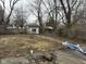 Spacious backyard featuring a shed, lawn, and ample space for outdoor activities and landscaping at 1126 N Mitthoeffer Rd, Indianapolis, IN 46229