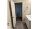 This bathroom showcases the vanity and sink, with view into an adjacent room at 1126 N Mitthoeffer Rd, Indianapolis, IN 46229