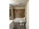The bathroom features a tiled shower-tub combination, a toilet, and a single sink vanity at 1126 N Mitthoeffer Rd, Indianapolis, IN 46229
