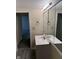 The bathroom includes a single sink vanity with a mirrored medicine cabinet and wood-look flooring at 1126 N Mitthoeffer Rd, Indianapolis, IN 46229