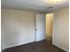 This bedroom offers carpet flooring and view to the adjacent room via an open door at 1126 N Mitthoeffer Rd, Indianapolis, IN 46229