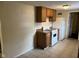 Functional kitchen with wooden cabinets and appliances, ready for your culinary touch at 1126 N Mitthoeffer Rd, Indianapolis, IN 46229