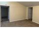 A basic living room with neutral carpet, offering a blank canvas for personalization at 1126 N Mitthoeffer Rd, Indianapolis, IN 46229