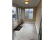 Sunroom featuring tile flooring and bright windows, perfect for enjoying natural light at 1126 N Mitthoeffer Rd, Indianapolis, IN 46229