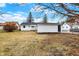 Large backyard features a white house and detached garage, with a clear view at 1157 Evans Ave, Noblesville, IN 46060