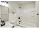 Clean bathroom featuring a tub and shower combo, with modern black fixtures at 1157 Evans Ave, Noblesville, IN 46060