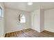 Bedroom with hardwood floors, closet, window with view, and electrical outlets on the wall at 1157 Evans Ave, Noblesville, IN 46060