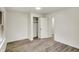 Bright bedroom featuring neutral walls, wood flooring, and ample closet space at 1157 Evans Ave, Noblesville, IN 46060