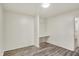Empty room featuring hardwood floors and white painted walls with a built in desk space at 1157 Evans Ave, Noblesville, IN 46060