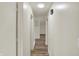 Clean and well-lit hallway leading to various rooms with vinyl flooring and fresh paint at 1157 Evans Ave, Noblesville, IN 46060