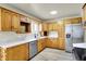 Bright kitchen with stainless steel appliances, light countertops, and ample cabinet space at 1157 Evans Ave, Noblesville, IN 46060