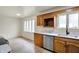 Cozy kitchen featuring stainless steel appliances, neutral countertops, and wood-look flooring at 1157 Evans Ave, Noblesville, IN 46060