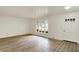 Bright living room boasting wood-look flooring, ample natural light, and neutral tones at 1157 Evans Ave, Noblesville, IN 46060