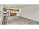 Open-concept living area showcasing wood flooring, a dining space, and kitchen at 1157 Evans Ave, Noblesville, IN 46060