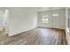 Bright living room featuring wood flooring, neutral walls, and natural light at 1157 Evans Ave, Noblesville, IN 46060
