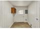 Mud room with wood paneled walls, wood flooring and an exterior door at 1157 Evans Ave, Noblesville, IN 46060